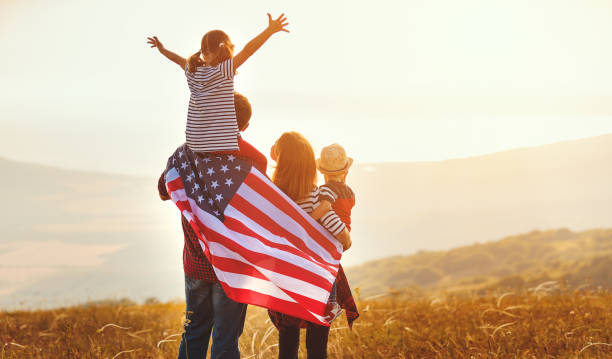 Patriotic family in field